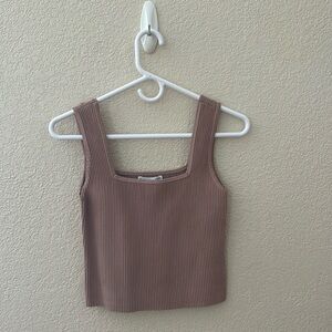 Woman’s cropped tank top. Brownish/tan color. Great material.